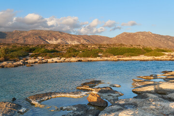 sunset beach Crete greece beach and bushes hills in the background