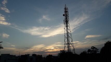 cell phone tower at sunset