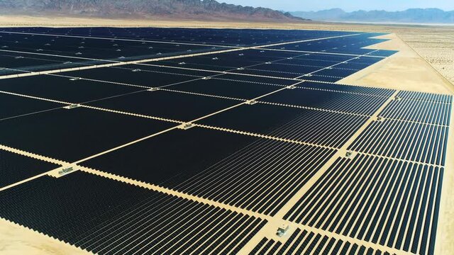 Aerial Of Solar Panels Field In California, Renewable Energy, Mirrors In The Middle Of Desert, The Future Of Power Generation Industry