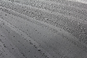 water drop on car in the after rain . 