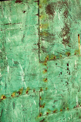 Beautiful abstract patterns and texture of rivted panels of exposed copper sheet with green aged patina