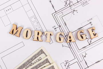 Inscription mortgage with currencies dollar on construction housing plan, buying house concept