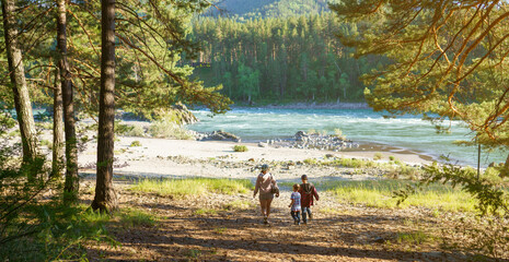 mother and two children walking to the beach