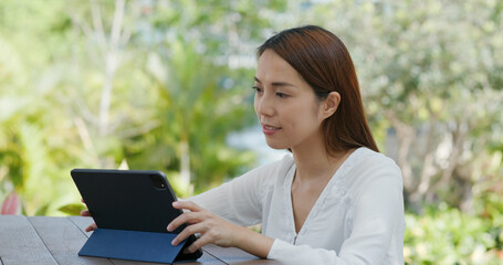Woman use of tablet at outdoor