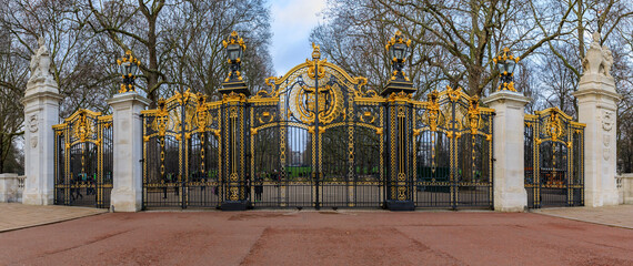 Ornate wrought iron and gold Canada Gate of the Green Park in front of the Buckingham Palace in London UK