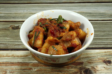 Fried spicy chopped belly pork with chilly paste, basil and local sauce in Thai style. Traditional famous street food menu with spicy taste and side dish with cooked rice. 
