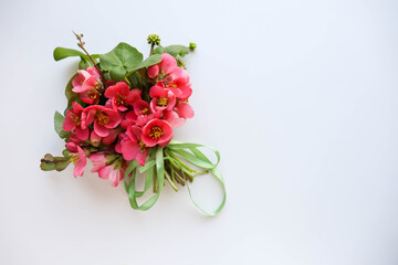 framework for invitation or congratulation. Greeting card mockup with space for text. small bouquet of pink flowers and an envelope on a white background. wedding invitation.