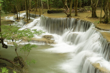 Fototapeta na wymiar Beautiful waterfall with stones in forest, Thailand