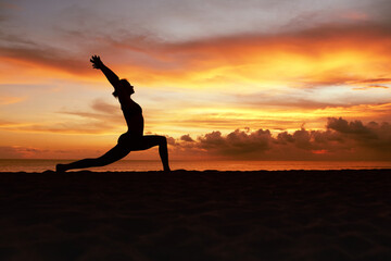 Yoga Poses. Woman Standing In Warrior Pose Asana On Ocean Beach. Female Silhouette Practicing Virabhadrasana At Beautiful Sunset. Yoga As Exercise For Lifestyle.