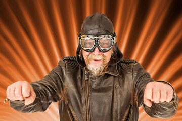 Fun motorcyclist posing on radiating background
