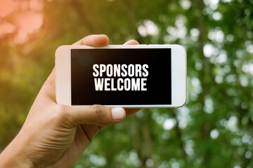  SPONSORS WELCOME word on smartphone with bokeh in background