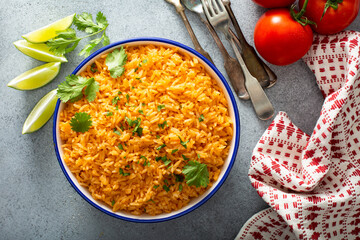 Mexican rice with tomatoes and onion served with cilantro