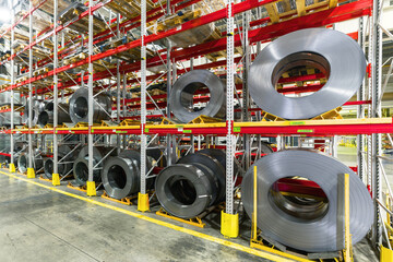 Tiered rack with sheet metal rolls. Internal warehouse of raw materials