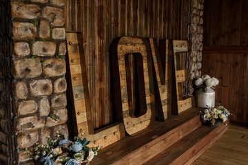 Wood word love in a photo studio.