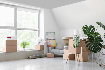 Packed belongings in new flat on moving day