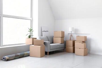 Packed belongings in new flat on moving day