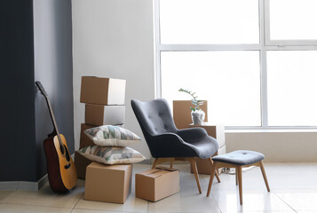 Packed belongings in new flat on moving day