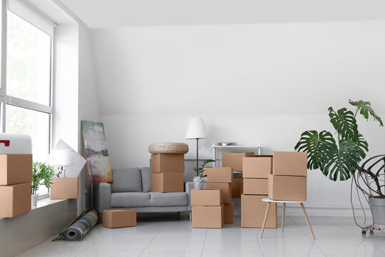 Packed belongings in new flat on moving day