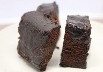 Black forest cake on a white plate.
Delicious black forest created manually.