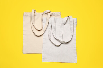 Eco bags on color background