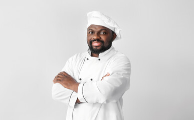 Male African-American chef on white background