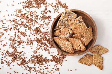 Plate with cereal cookies and flax seeds on table