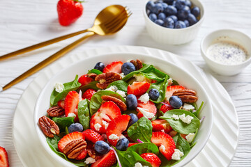 close-up of berry spinach pecan summer salad