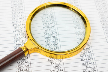 Financial documents - reports and magnifier. Financial concept