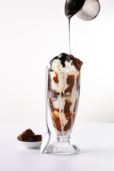 Chocolate ice cream sundae with whipped cream and cherry on top