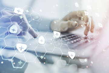 Creative concept of abstract medical illustration and hands typing on laptop on background....