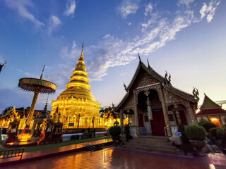 Fototapeta premium the beautiful golden pagoda of Wat Prathat Hariphunchai, Lamphun, Thailand