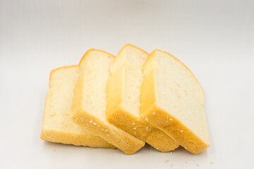 Four slices of bread arranged on a white background.