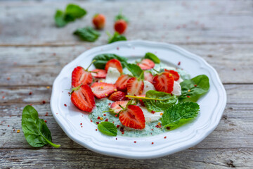 A healthy and delicious salad made from fresh strawberries and mozzarella.