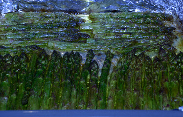 grilled green vegan asparagus in a pan ready-to-eat