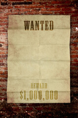 wanted poster on brick wall