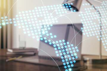 Abstract creative world map with connections on modern laptop background, international trading concept. Multiexposure