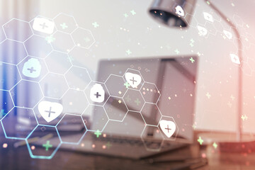Creative abstract medical hologram on modern computer background, online medical consulting concept. Multiexposure