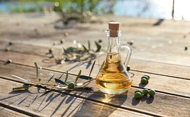 Obraz na płótnie Canvas olive oil and green olives outdoor