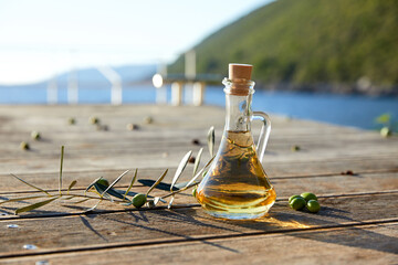 Obraz na płótnie Canvas olive oil and green olives outdoor