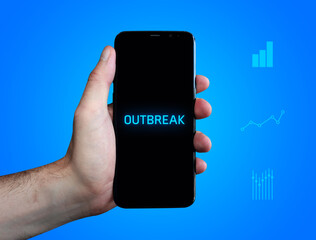Outbreak (pandemic). Hand holds phone (cell phone). Word on display. Charts on blue background. Business