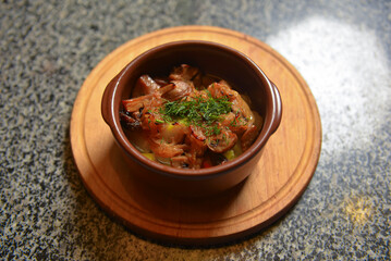 Tasty traditional hot pot stew with meat and vegetables stewed in a rich gravy.