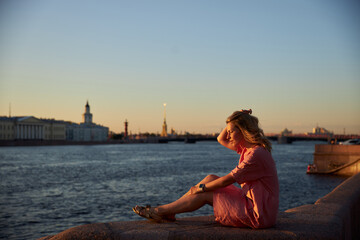 young woman sitting on the pier