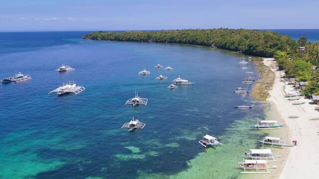 Turquoise paradise Boracay island Philippines with tourist Banca boats