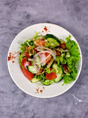 Vegetable salad of cucumbers, tomatoes and onions