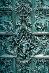 Main bronze door of the Milan Cathedral (Duomo di Milano) designed by Italian sculptor Ludovico...