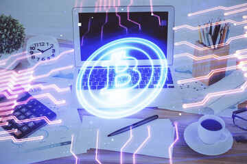 Double exposure of blockchain and crypto economy theme hologram and table with computer background. Concept of bitcoin cryptocurrency.