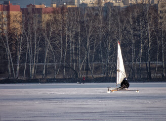 Slide in full sail on the river ice