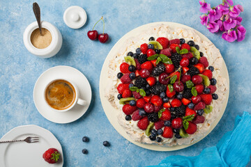 Meringue Pavlova cake with fresh fruit. Top view.