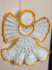 Christmas tree decoration. Crochet angel. Handmade ornament. Selective focus.