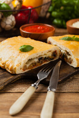 Italian calzone with mushrooms and ham.